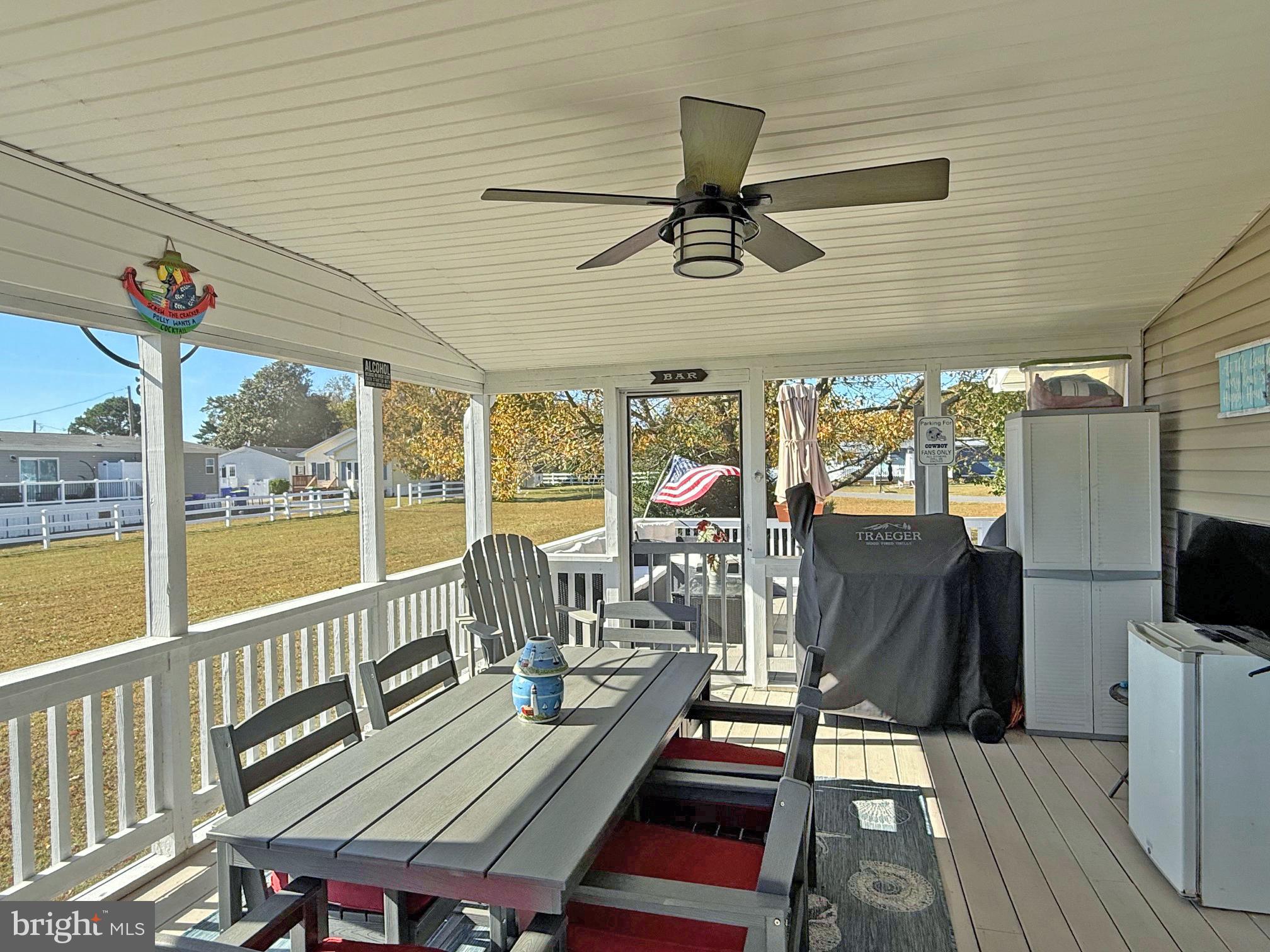 27137 Clipper Road, Unit M55 Millsboro, DE 19966 - Photo 23 of 48 a view of a chairs and table in patio