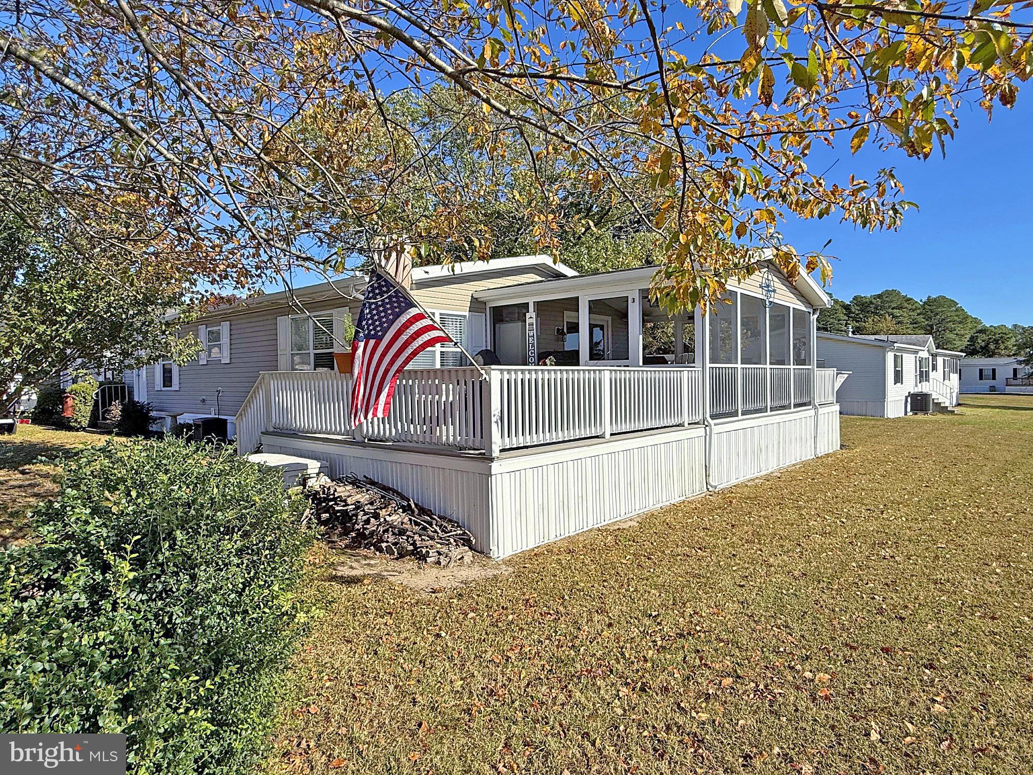 27137 Clipper Road, Unit M55 Millsboro, DE 19966 - Photo 25 of 48 a house with trees in front of it