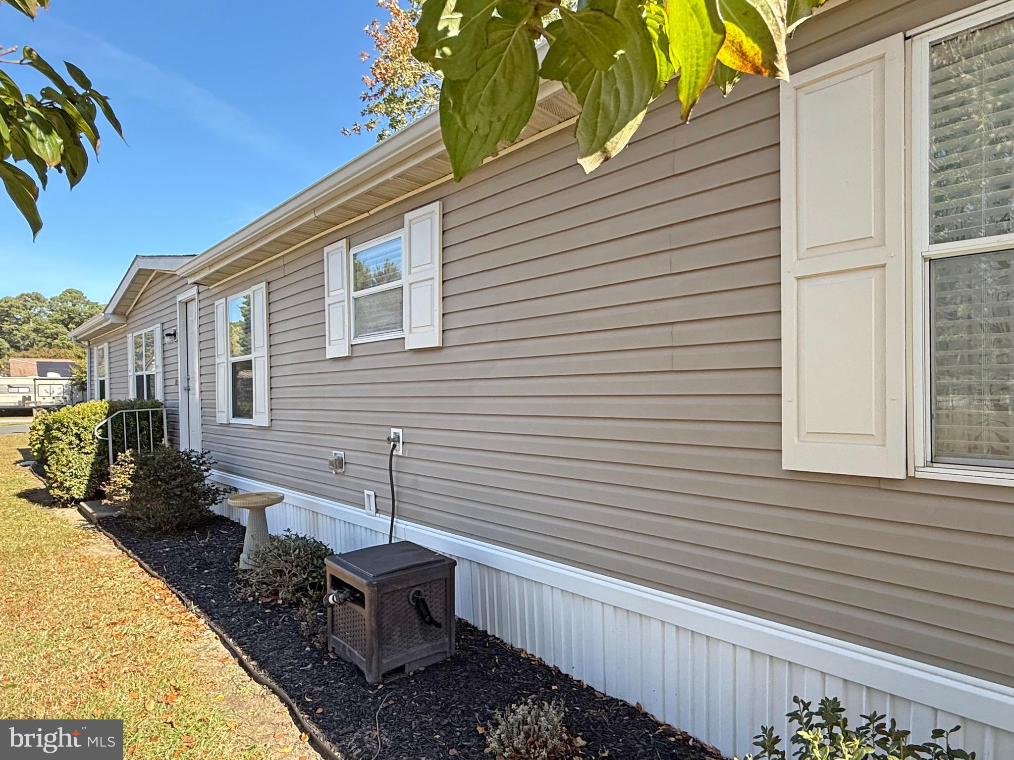 27137 Clipper Road, Unit M55 Millsboro, DE 19966 - Photo 3 of 48 a house view with a backyard space