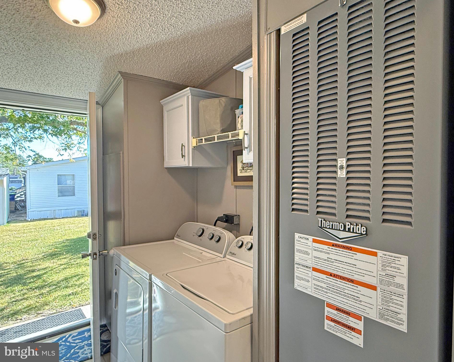 27137 Clipper Road, Unit M55 Millsboro, DE 19966 - Photo 38 of 48 a utility room with washer and dryer