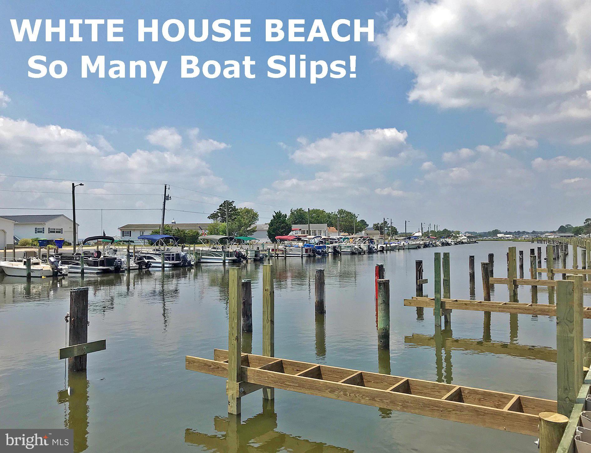 27137 Clipper Road, Unit M55 Millsboro, DE 19966 - Photo 46 of 48 a view of a lake with boats