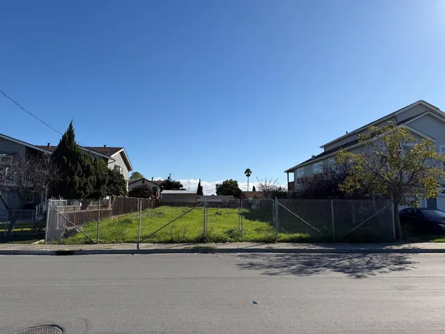a view of a house with a street