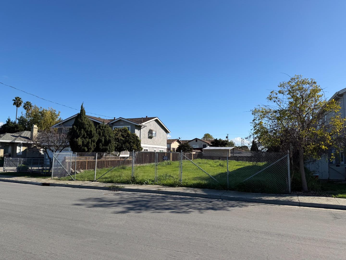 1553 State Street Alviso, CA 95002 - Photo 2 of 6 a view of a house with a yard and a street