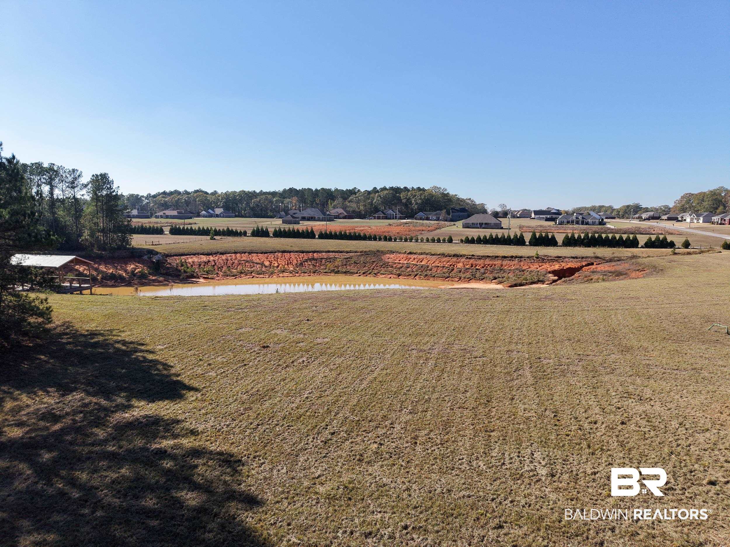 0 Stokley Court Atmore, AL 36502 - Photo 22 of 22 View of green lawn featuring a water view