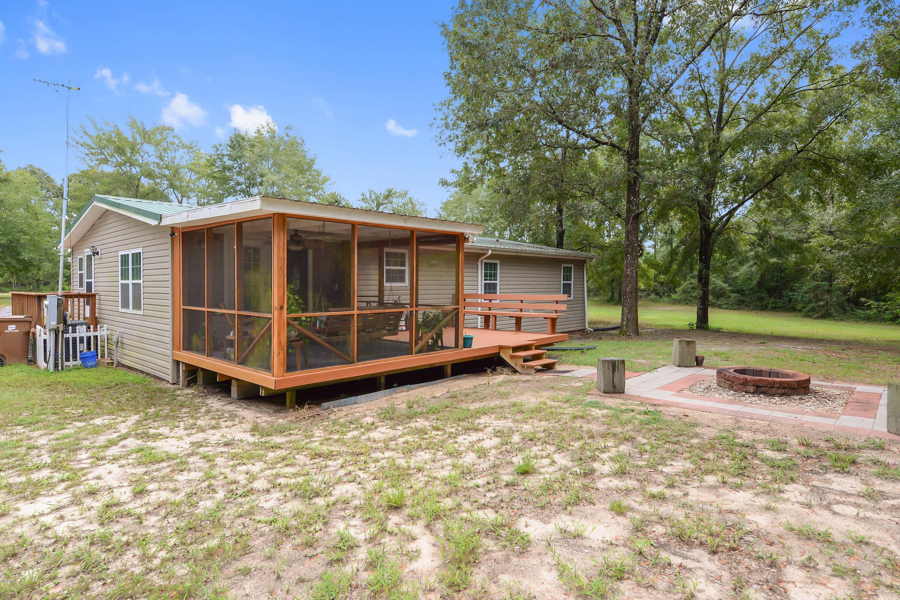 21173 Turan Road Saucier, MS 39574 - Photo 4 of 32 Screened back porch