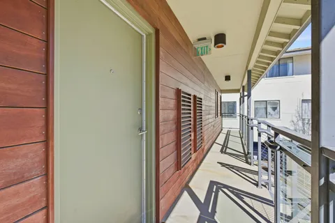 a view of a house with backyard porch and sitting area