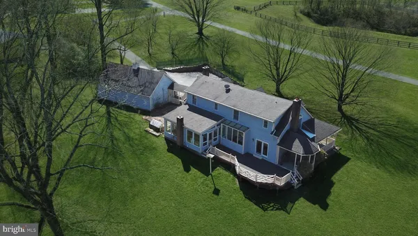 an aerial view of a house with a garden