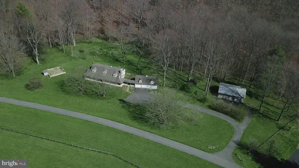 aerial view of a house with a yard