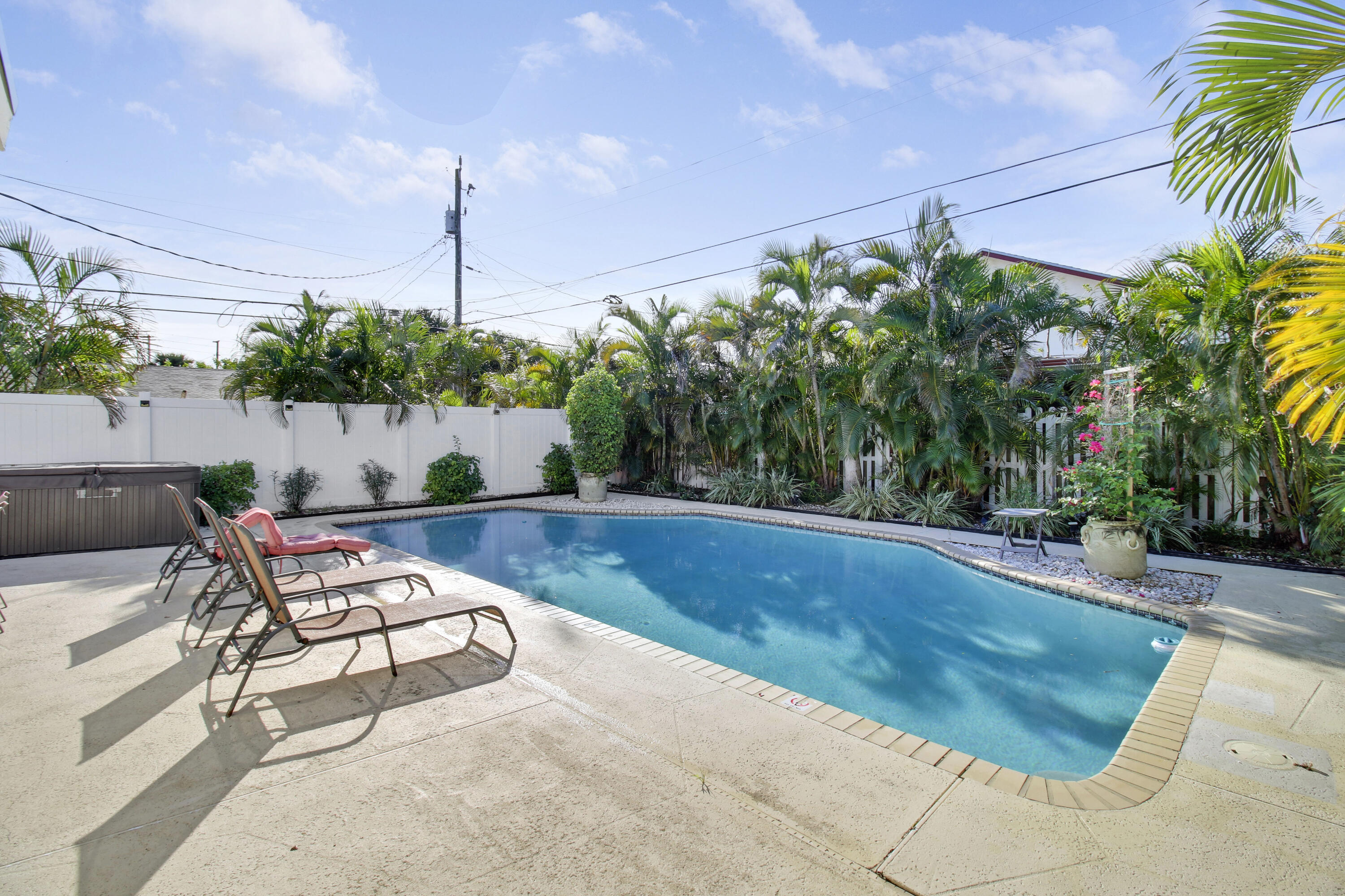 500 Mayflower Road West Palm Beach, FL 33405 - Photo 17 of 22 a view of swimming pool with outdoor seating and plants