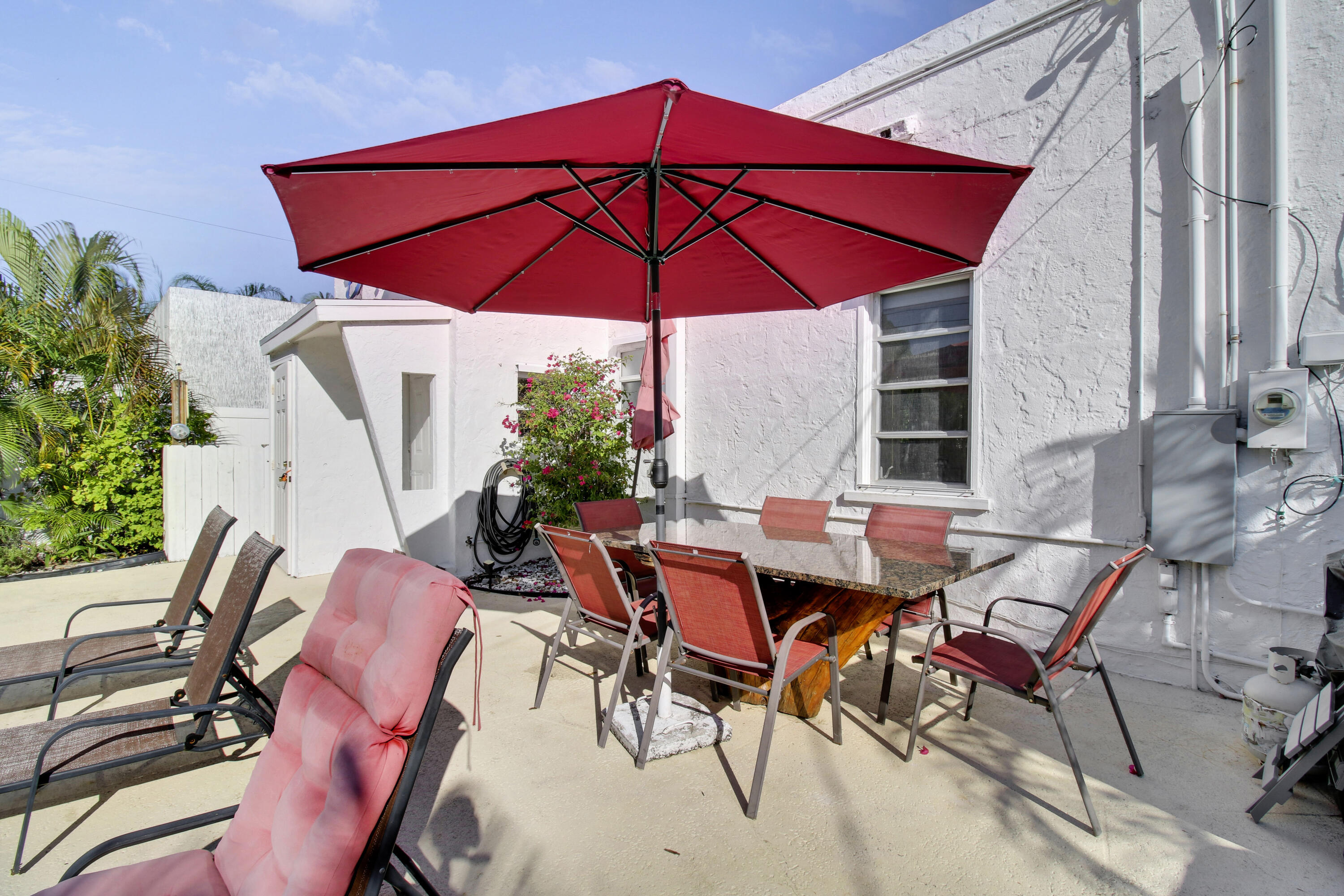 500 Mayflower Road West Palm Beach, FL 33405 - Photo 18 of 22 an outdoor space with furniture and umbrella