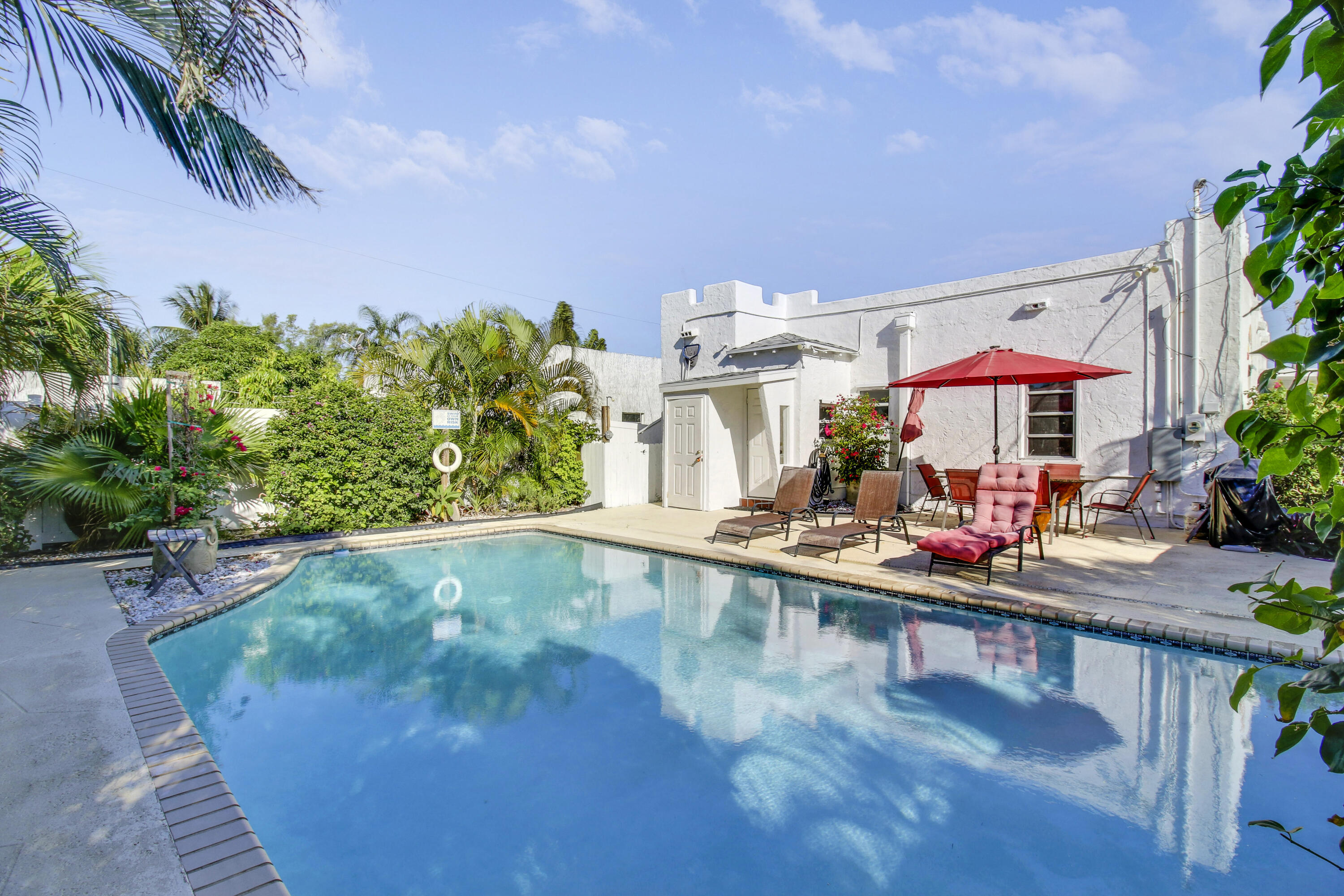 500 Mayflower Road West Palm Beach, FL 33405 - Photo 4 of 22 a view of a swimming pool with a patio