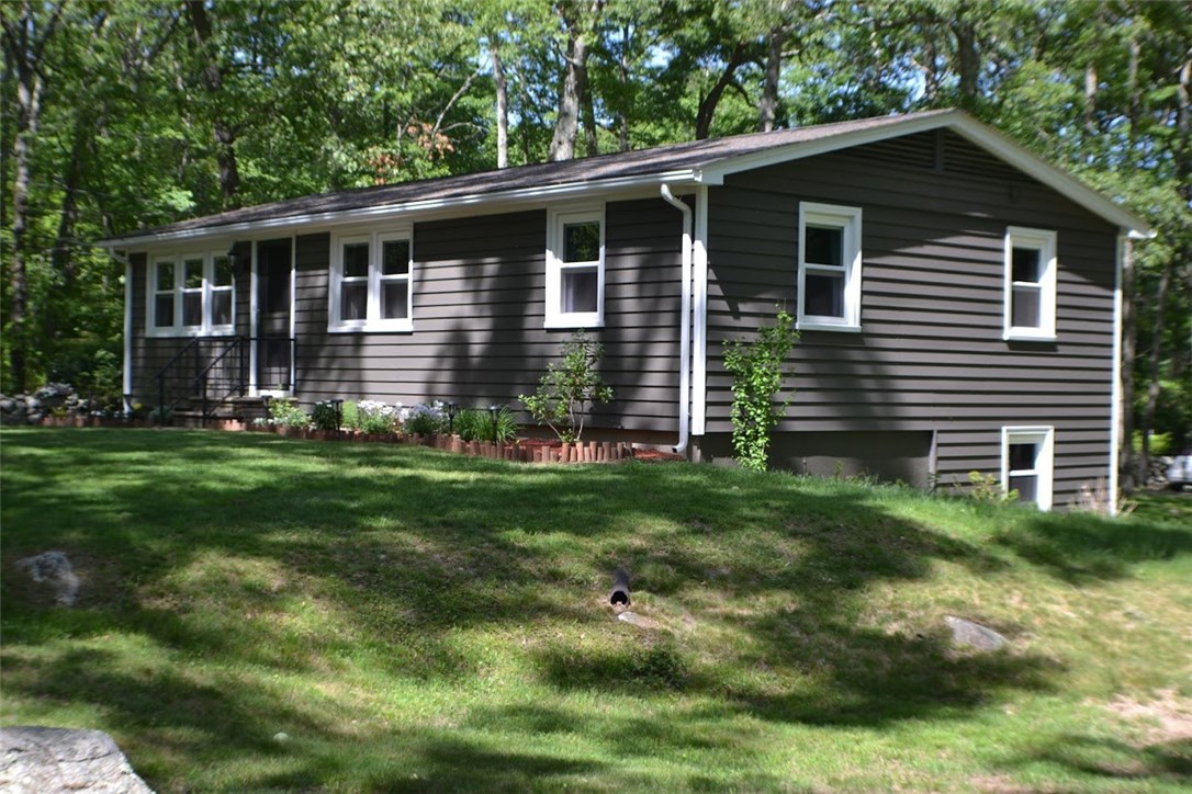 1050 Slocum Road North Kingstown, RI 02874 - Photo 3 of 26 Side view featuring all new windows from October 2017 and high-end vinyl siding