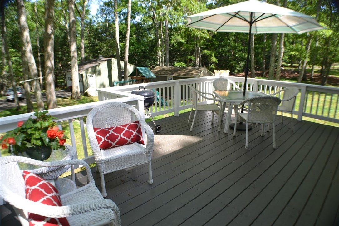 1050 Slocum Road North Kingstown, RI 02874 - Photo 5 of 26 Stunning deck freshly painted with PPG custom paint to match the house. View of the spacious yard with a view of all outer buildings.