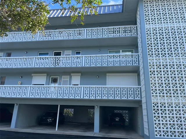 a view of a roof deck with a table and chairs