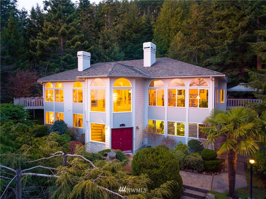 4191 Islander Way Anacortes, WA 98221 - Photo 1 of 40 a front view of multi story residential apartment building with yard and seating area