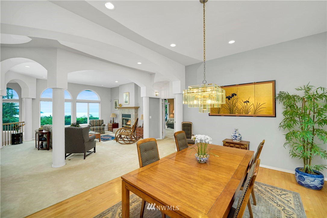 4191 Islander Way Anacortes, WA 98221 - Photo 11 of 40 a view of a dining room with furniture window and wooden floor
