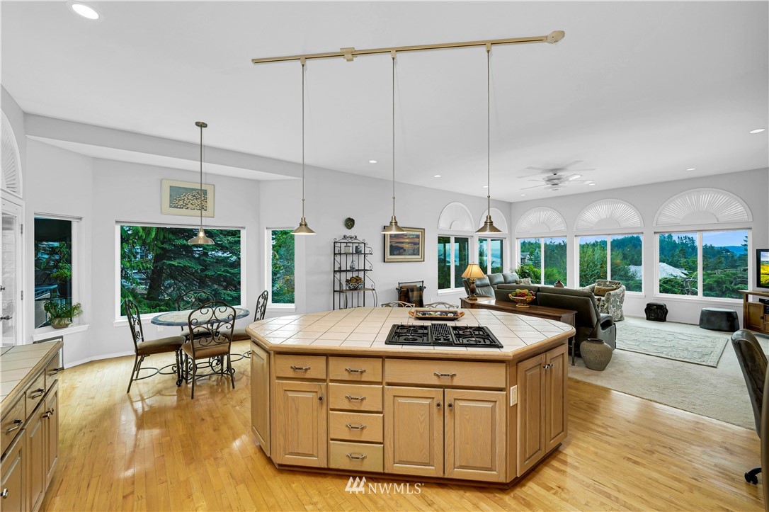 4191 Islander Way Anacortes, WA 98221 - Photo 14 of 40 a kitchen with stainless steel appliances granite countertop a stove and a wooden cabinets