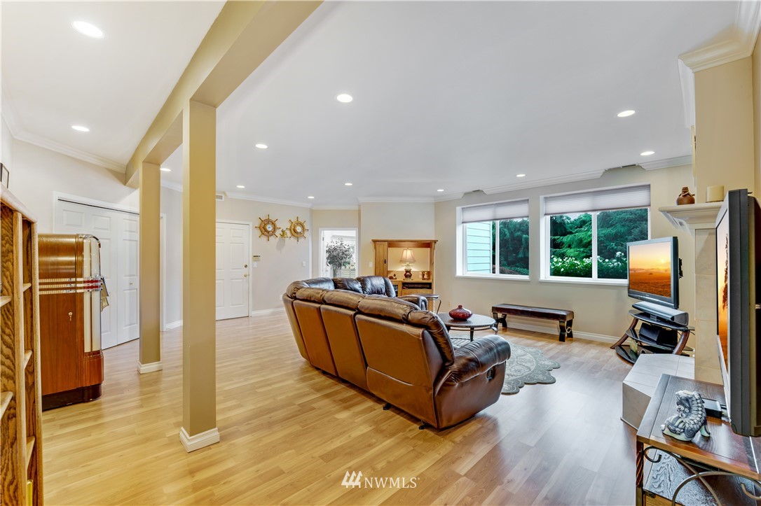 4191 Islander Way Anacortes, WA 98221 - Photo 28 of 40 a living room with furniture window and a flat screen tv