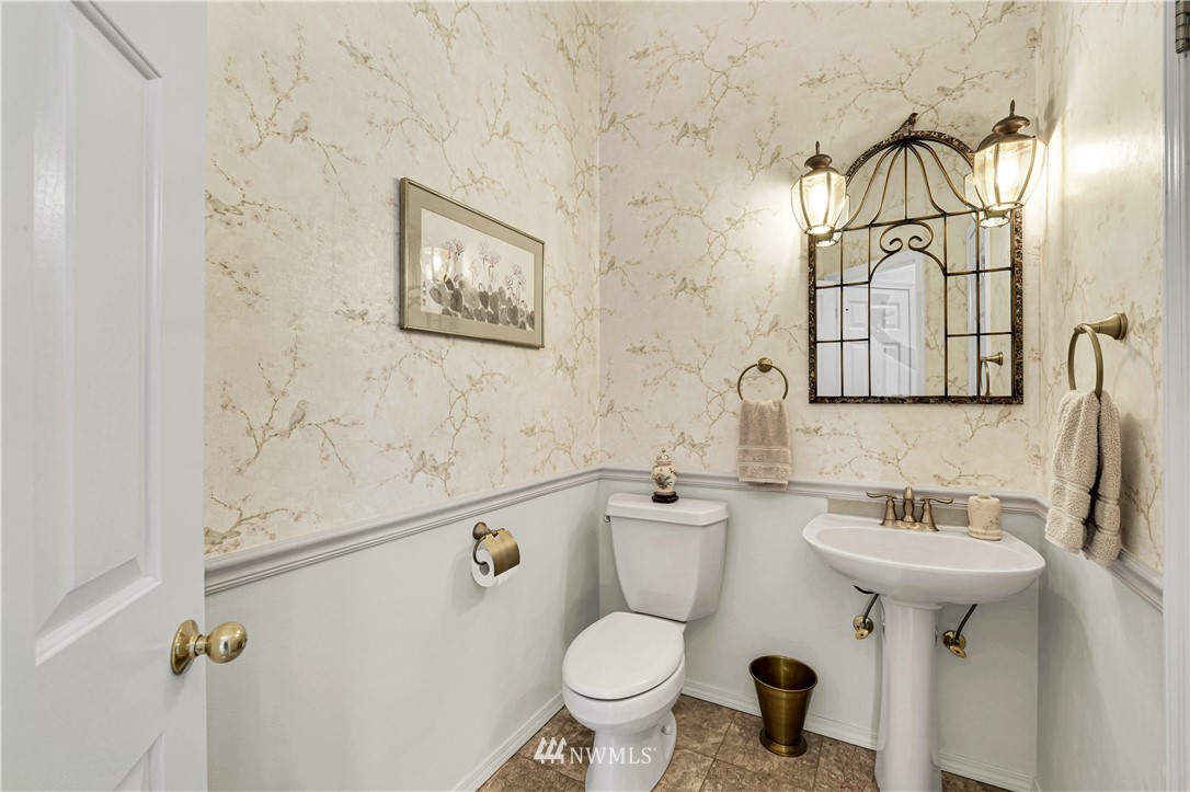 4191 Islander Way Anacortes, WA 98221 - Photo 30 of 40 a bathroom with a sink toilet and mirror