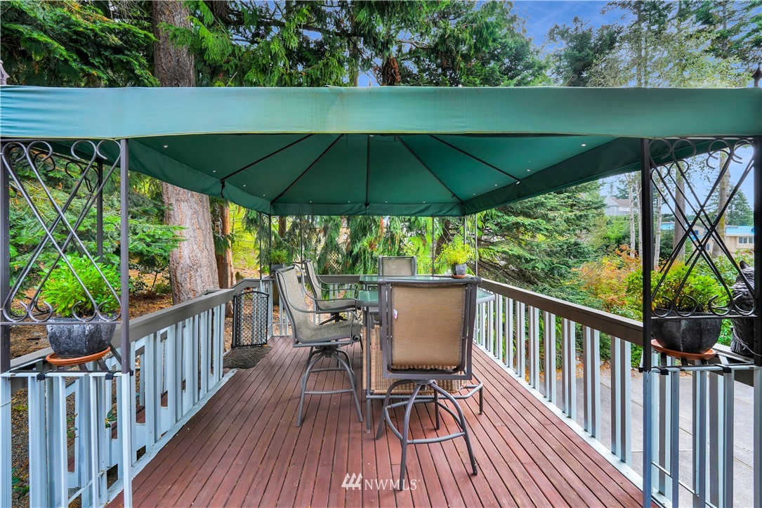 4191 Islander Way Anacortes, WA 98221 - Photo 37 of 40 a view of deck with furniture and barbeque oven in the backyard