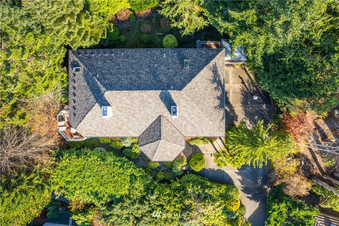 4191 Islander Way Anacortes, WA 98221 - Photo 39 of 40 an aerial view of a house with a yard and large trees