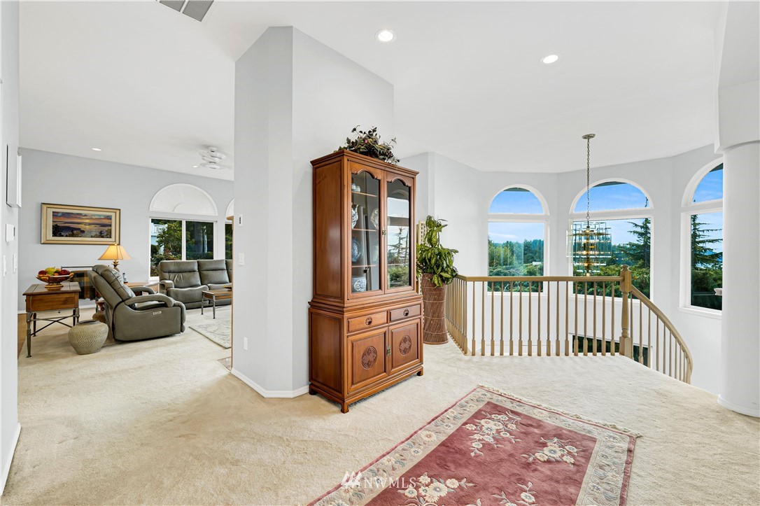 4191 Islander Way Anacortes, WA 98221 - Photo 8 of 40 a view of a livingroom with furniture wooden floor and windows