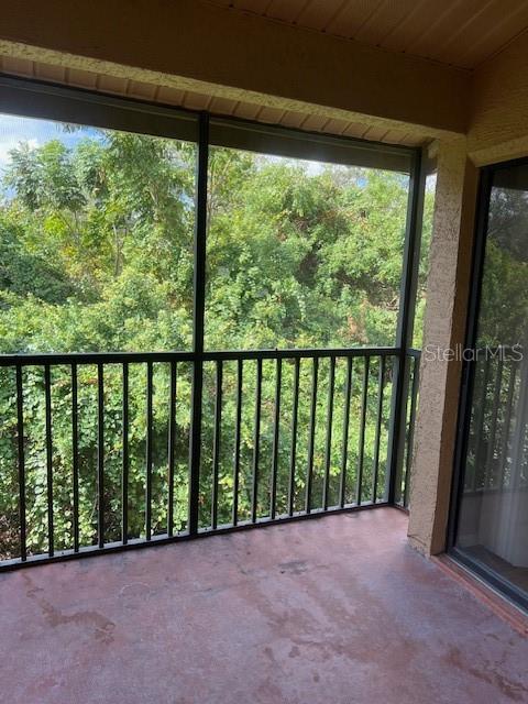 7757 Sugar Bend Drive, Unit 7757 Orlando, FL 32819 - Photo 13 of 30 a view of hallway with a outdoor space