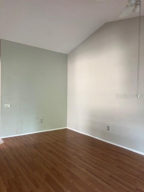 7757 Sugar Bend Drive, Unit 7757 Orlando, FL 32819 - Photo 14 of 30 a view of an empty room with wooden floor