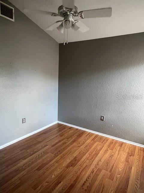7757 Sugar Bend Drive, Unit 7757 Orlando, FL 32819 - Photo 18 of 30 a view of an empty room with wooden floor
