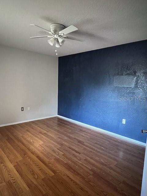 7757 Sugar Bend Drive, Unit 7757 Orlando, FL 32819 - Photo 20 of 30 a view of an empty room with a chandelier fan