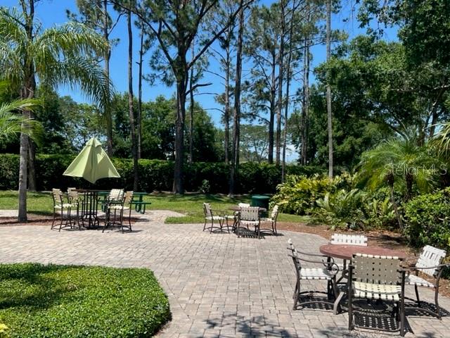 7757 Sugar Bend Drive, Unit 7757 Orlando, FL 32819 - Photo 29 of 30 a view of a park with chairs