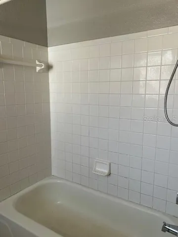 a bathroom with a shower and a bathtub