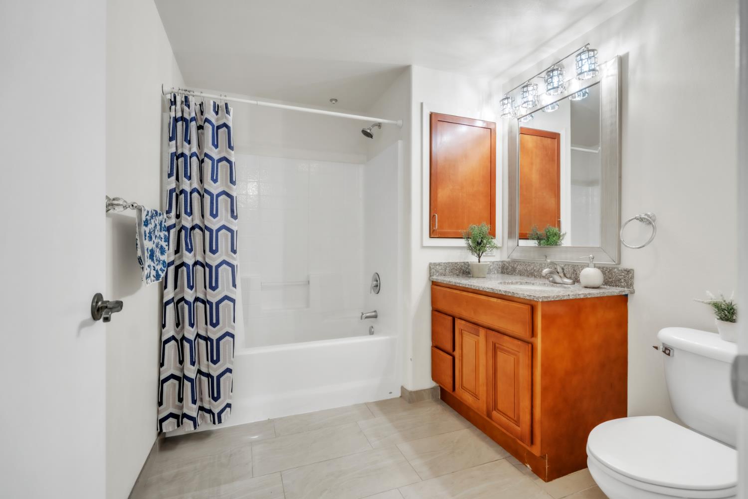4200 East Commerce Way, Unit 1611 Sacramento, CA 95834 - Photo 13 of 39 a bathroom with a sink a toilet and shower