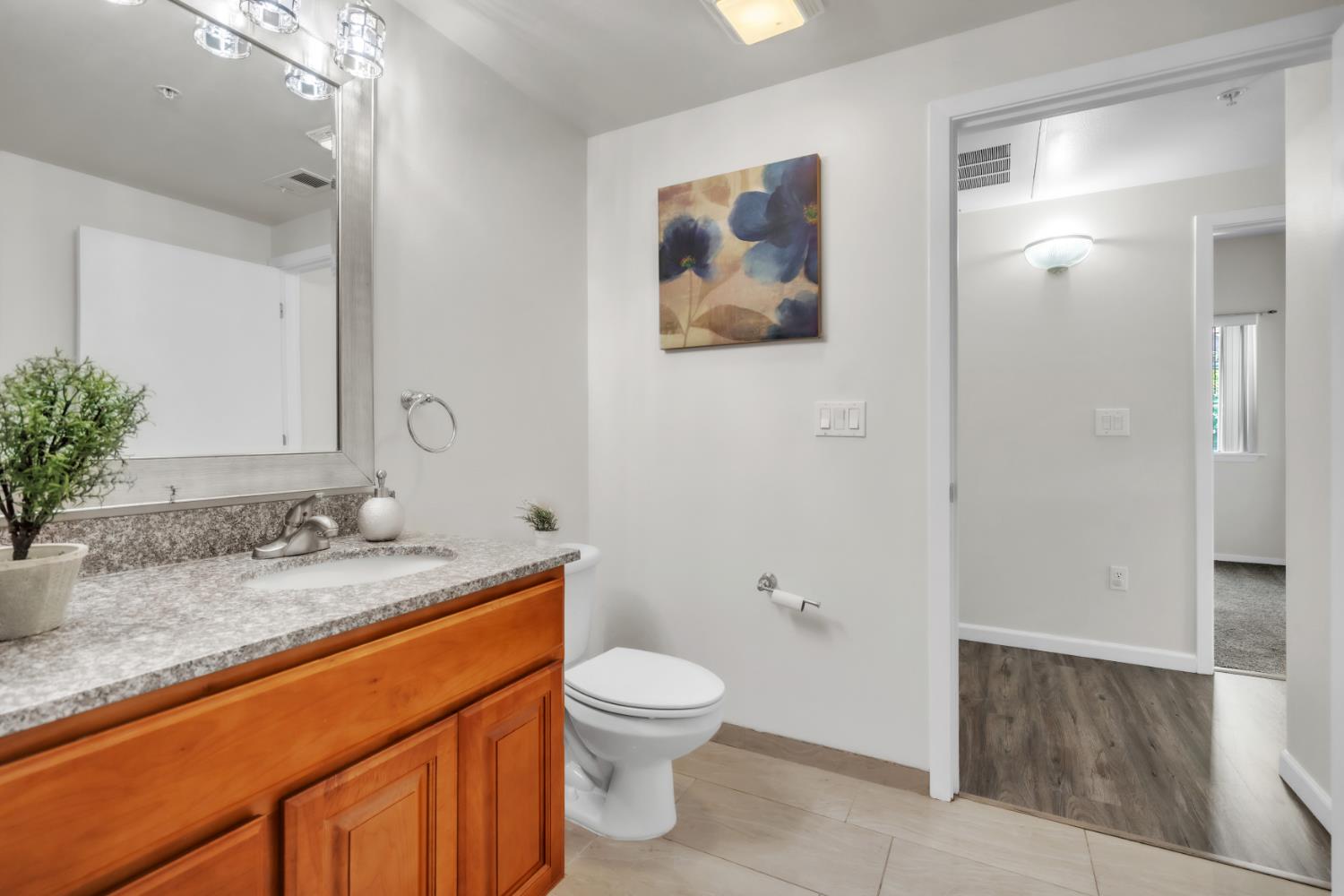 4200 East Commerce Way, Unit 1611 Sacramento, CA 95834 - Photo 14 of 39 a bathroom with a granite countertop sink toilet and shower