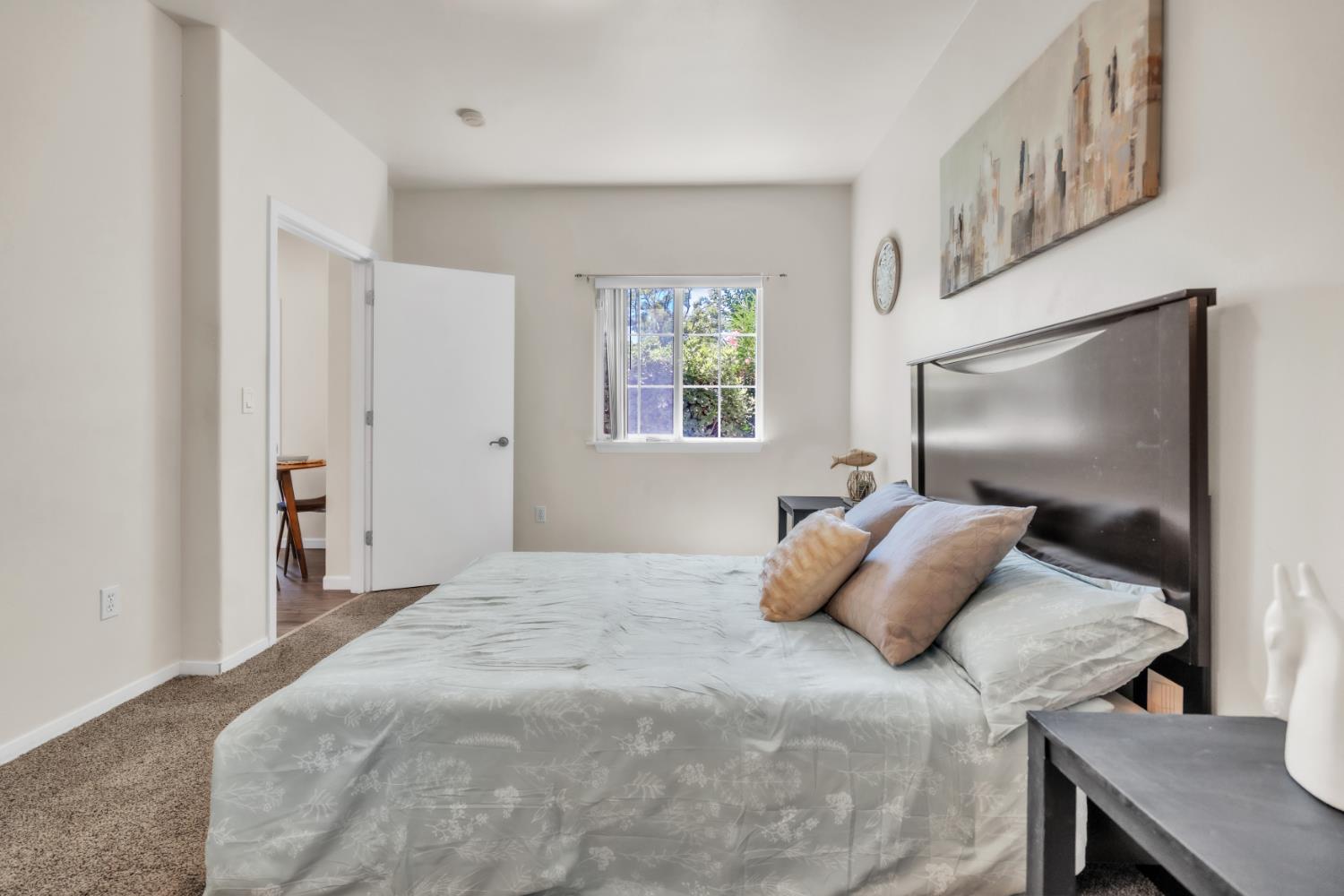4200 East Commerce Way, Unit 1611 Sacramento, CA 95834 - Photo 16 of 39 a bedroom with a bed and a flat screen tv