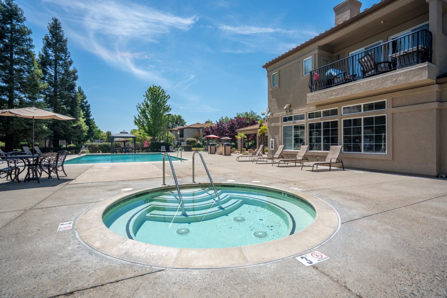 4200 East Commerce Way, Unit 1611 Sacramento, CA 95834 - Photo 36 of 39 a view of a swimming pool with sitting area