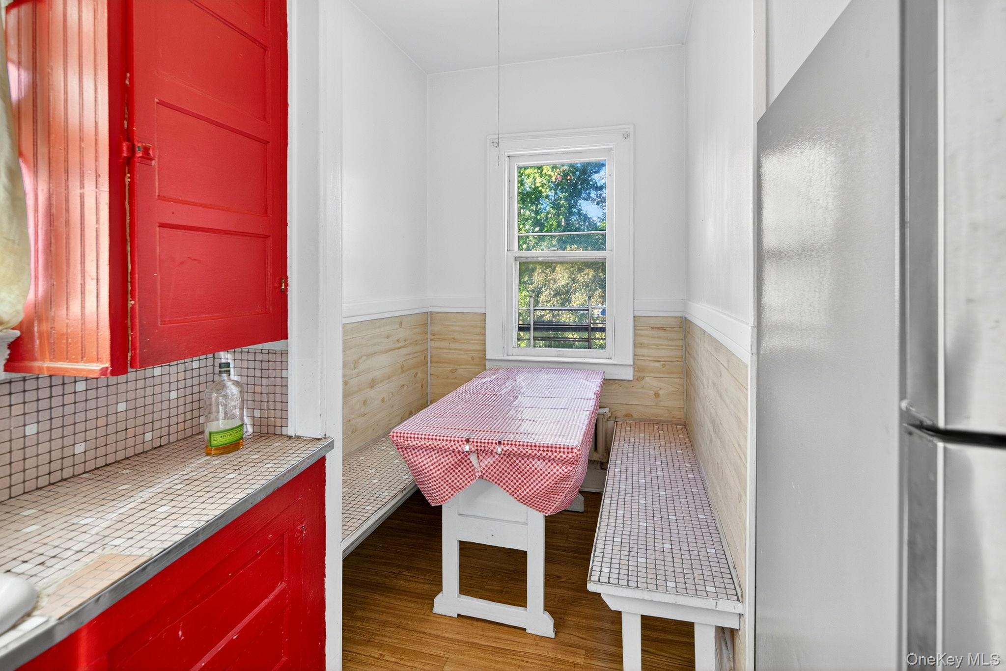 964 State Street Schenectady, NY 12307 - Photo 14 of 24 Dining area with wood finished floors and a wainscoted wall