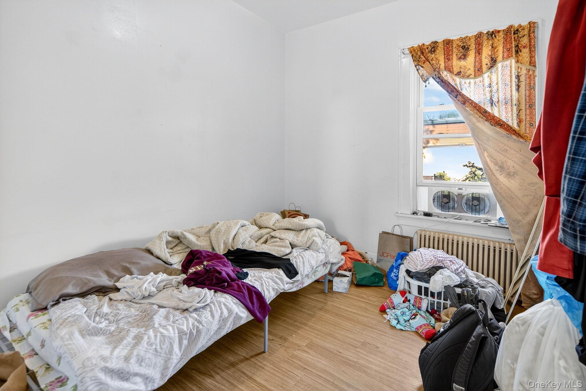 964 State Street Schenectady, NY 12307 - Photo 19 of 24 Bedroom featuring radiator and wood finished floors