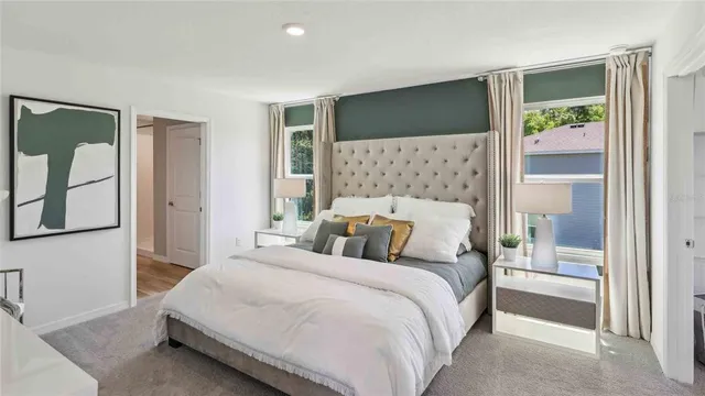 a bedroom with a bed and a dresser