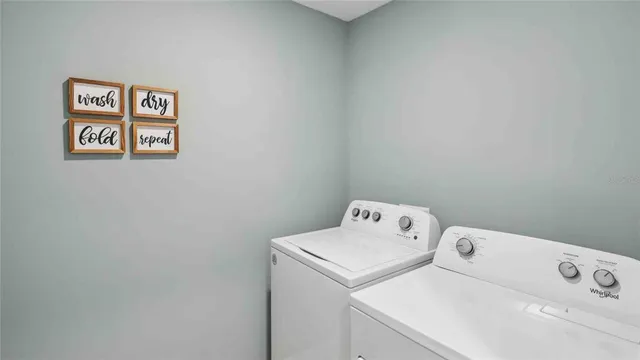 a bedroom with a bed and window with lamp