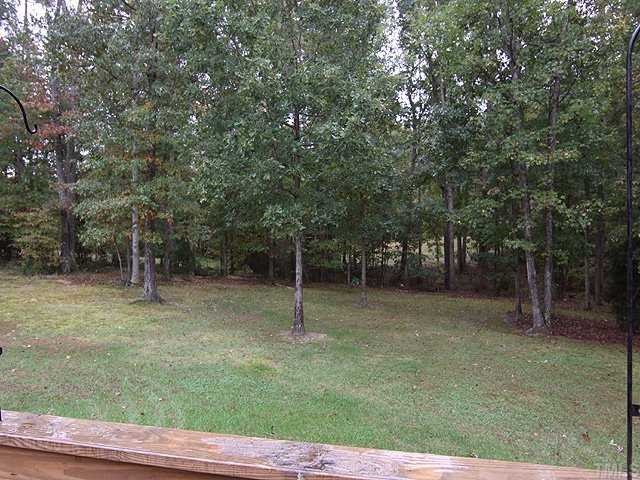 1170 Wrenn Crumpton Road Roxboro, NC 27574 - Photo 11 of 12 a backyard of a house with lots of green space