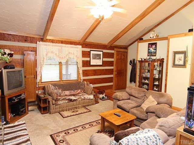 1170 Wrenn Crumpton Road Roxboro, NC 27574 - Photo 3 of 12 a living room with furniture and a flat screen tv