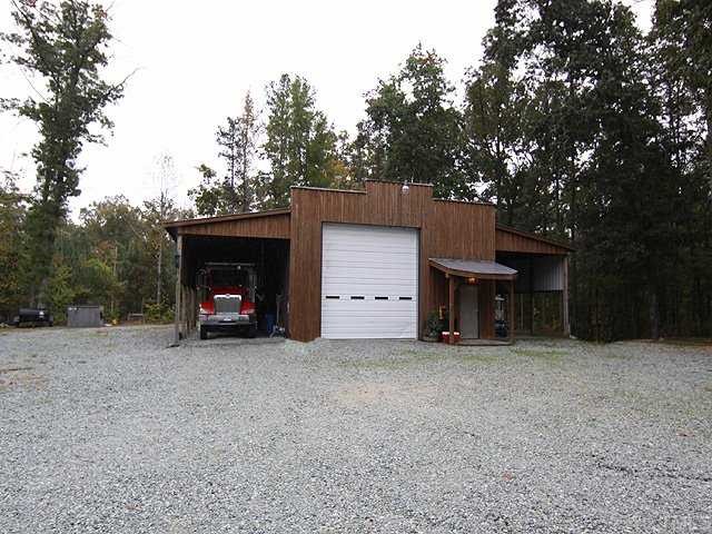 1170 Wrenn Crumpton Road Roxboro, NC 27574 - Photo 9 of 12 a view of a house with a garage