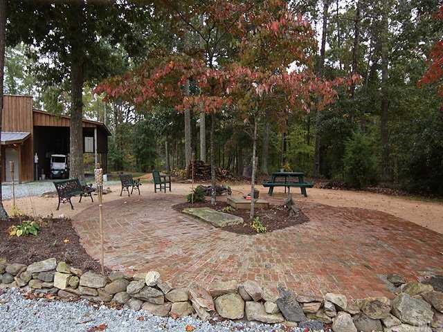 1170 Wrenn Crumpton Road Roxboro, NC 27574 - Photo 10 of 12 a view of a patio with chairs and tables