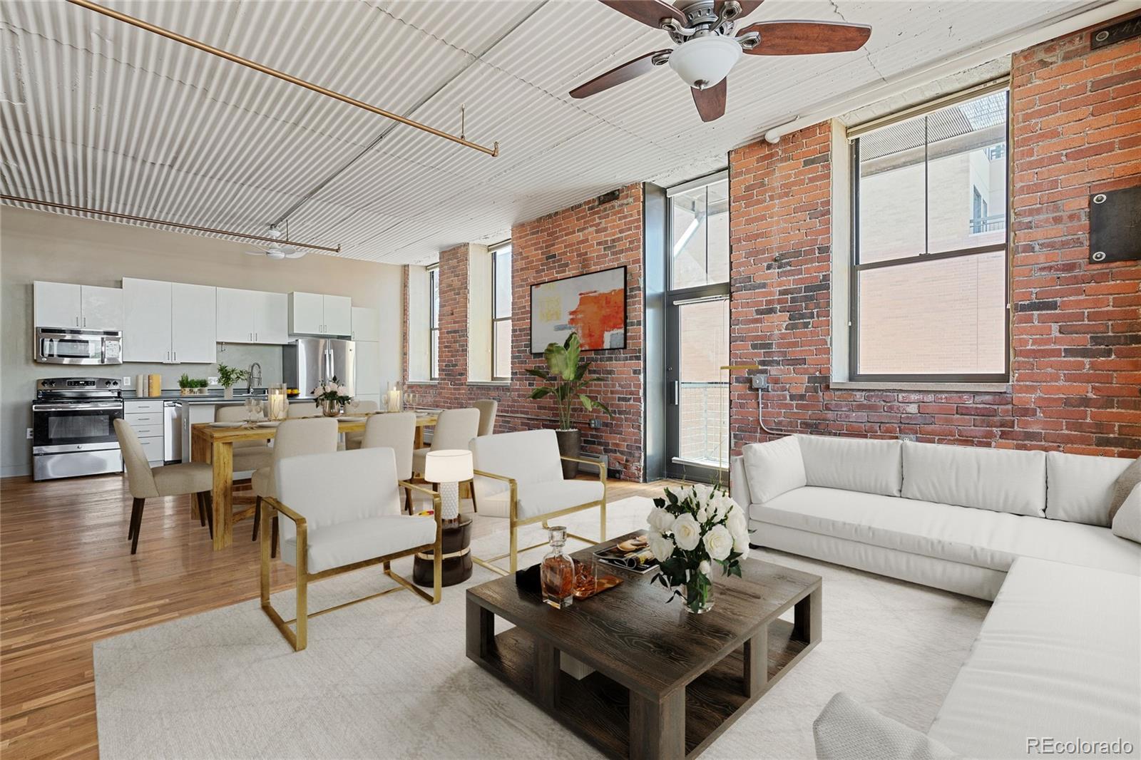 2261 Blake Street, Unit 4D Denver, CO 80205 - Photo 2 of 15 a living room with furniture and a large window