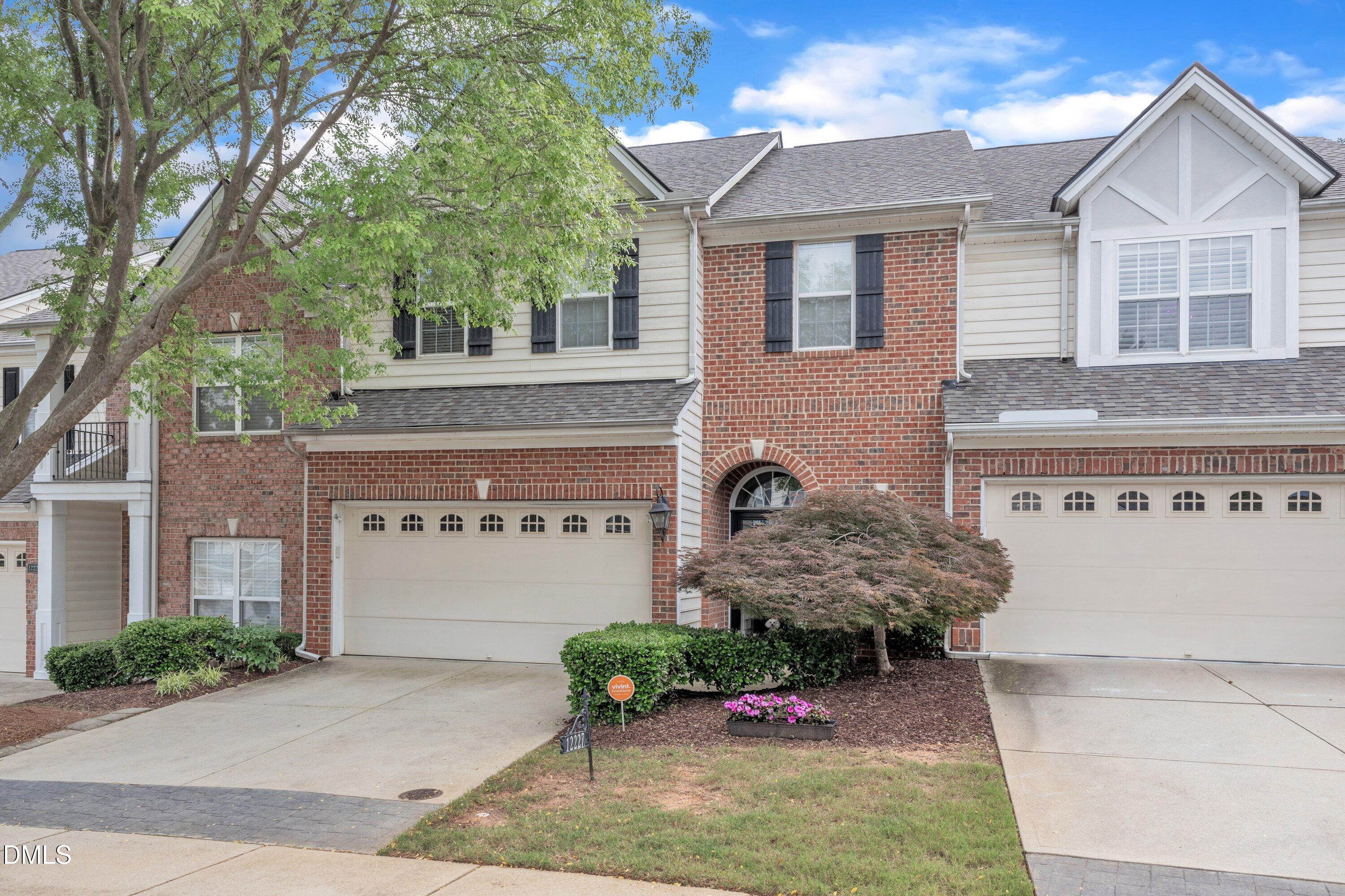 12227 Orchardgrass Lane Raleigh, NC 27614 - Photo 2 of 46 a front view of a house with garden