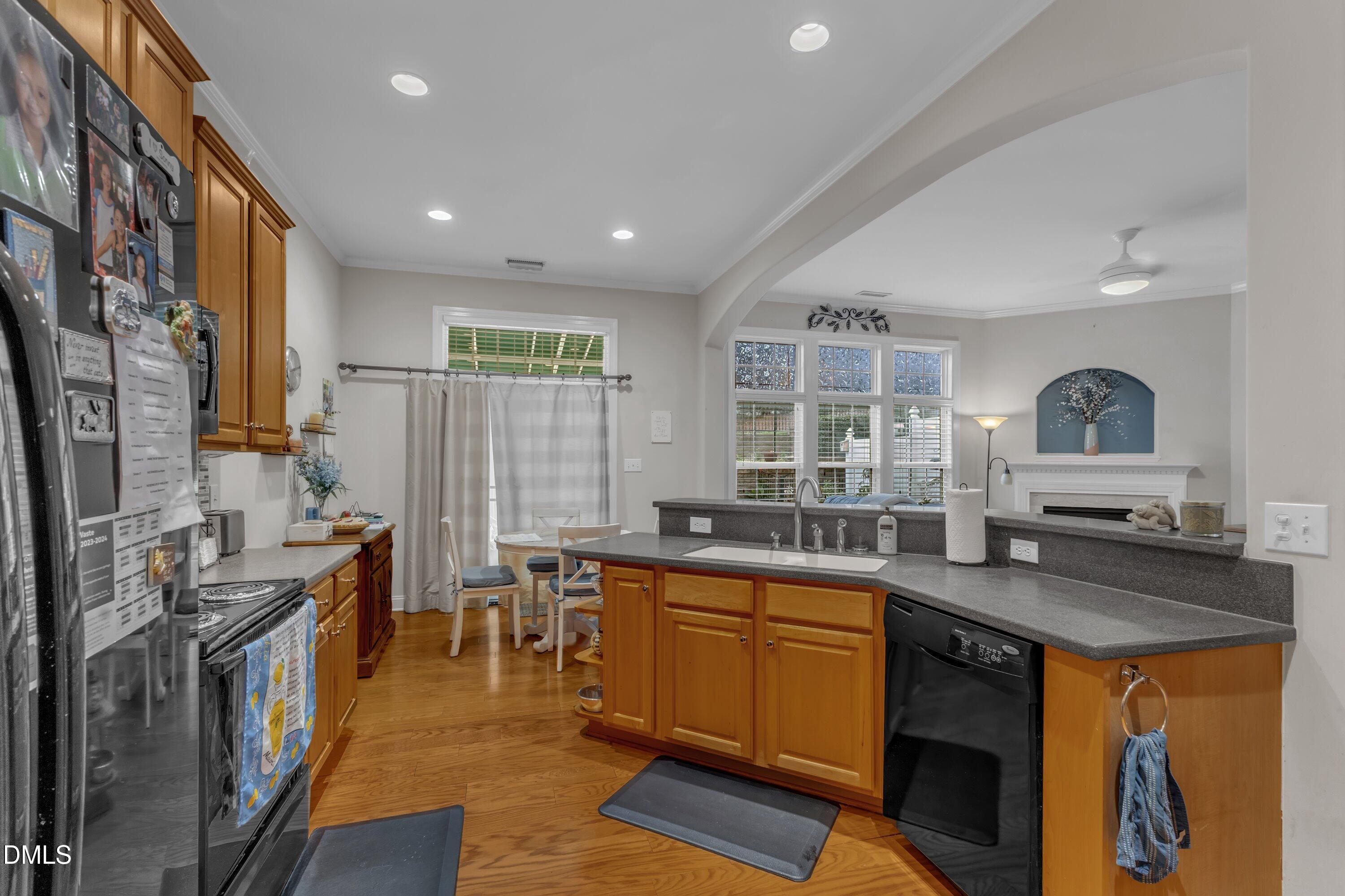 12227 Orchardgrass Lane Raleigh, NC 27614 - Photo 22 of 46 a kitchen with granite countertop a sink a counter top space and stainless steel appliances