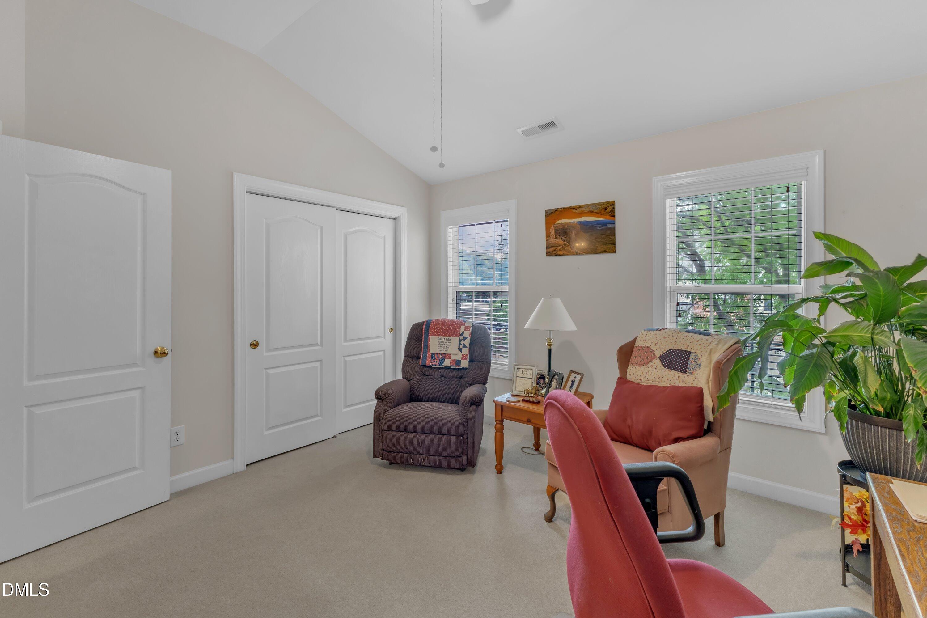 12227 Orchardgrass Lane Raleigh, NC 27614 - Photo 27 of 46 a living room with furniture a window and a potted plant