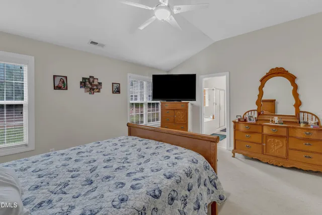 a bed room with a bed and a couch