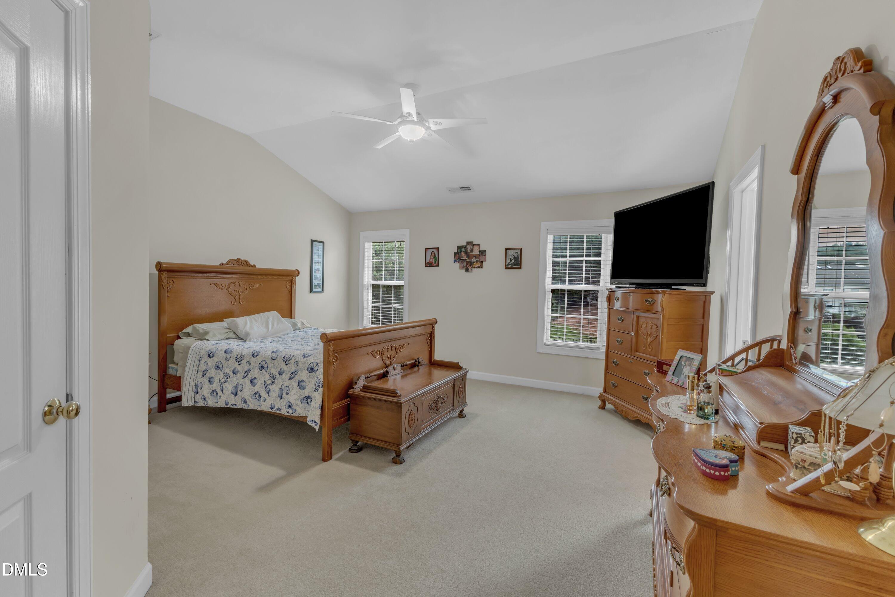 12227 Orchardgrass Lane Raleigh, NC 27614 - Photo 33 of 46 a living room with furniture and a flat screen tv
